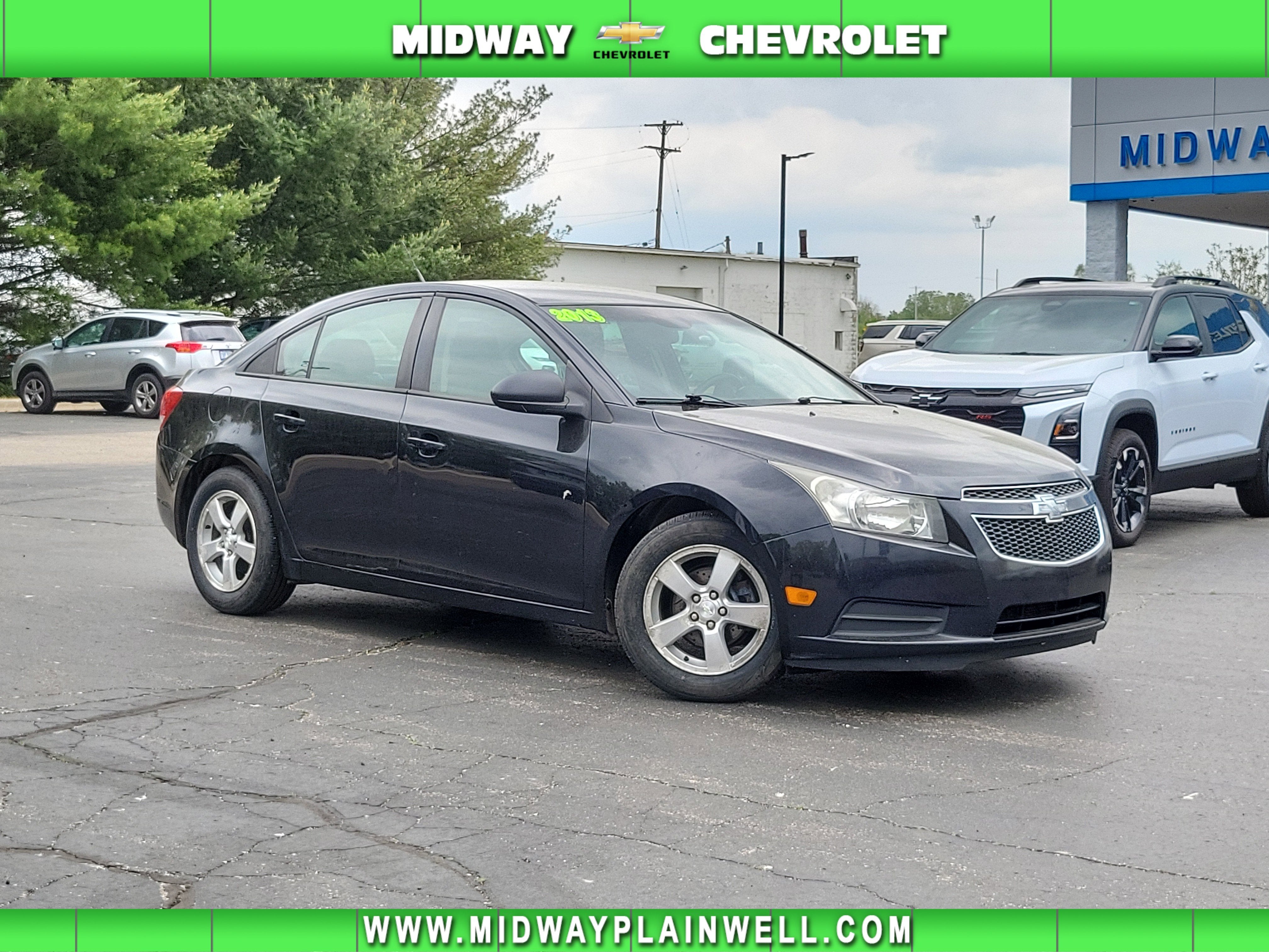 2013 Chevrolet Cruze LS in Black Granite Metallic — front three-quarter view
