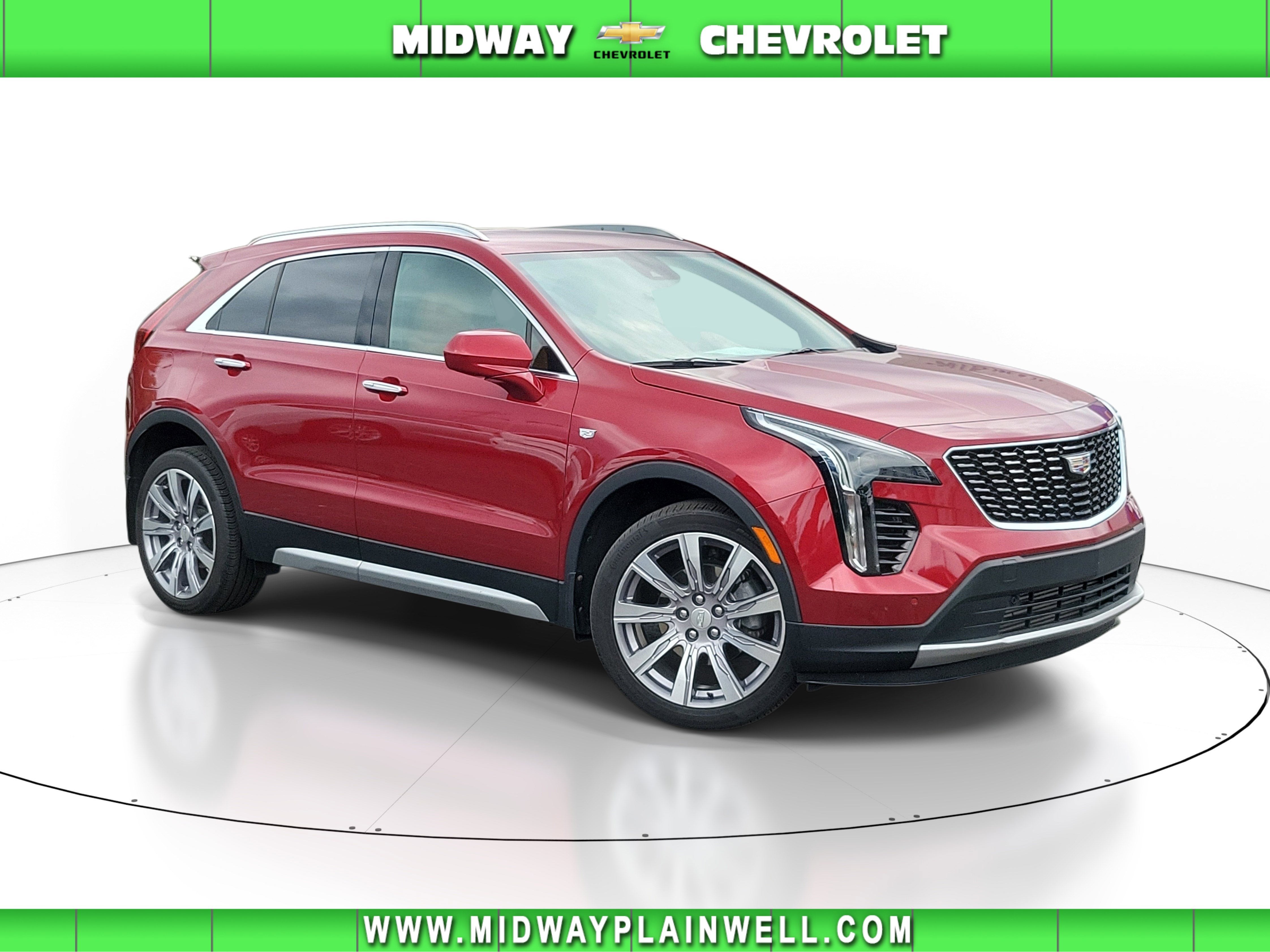 2020 Cadillac XT4 AWD Premium Luxury in Red Horizon Tintcoat — front three-quarter view